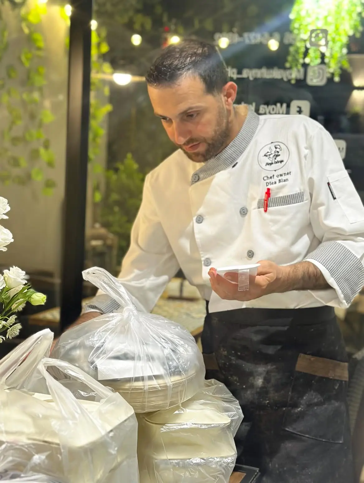 Chef-owner Diea Blan preparing orders at Moya Kuhnya