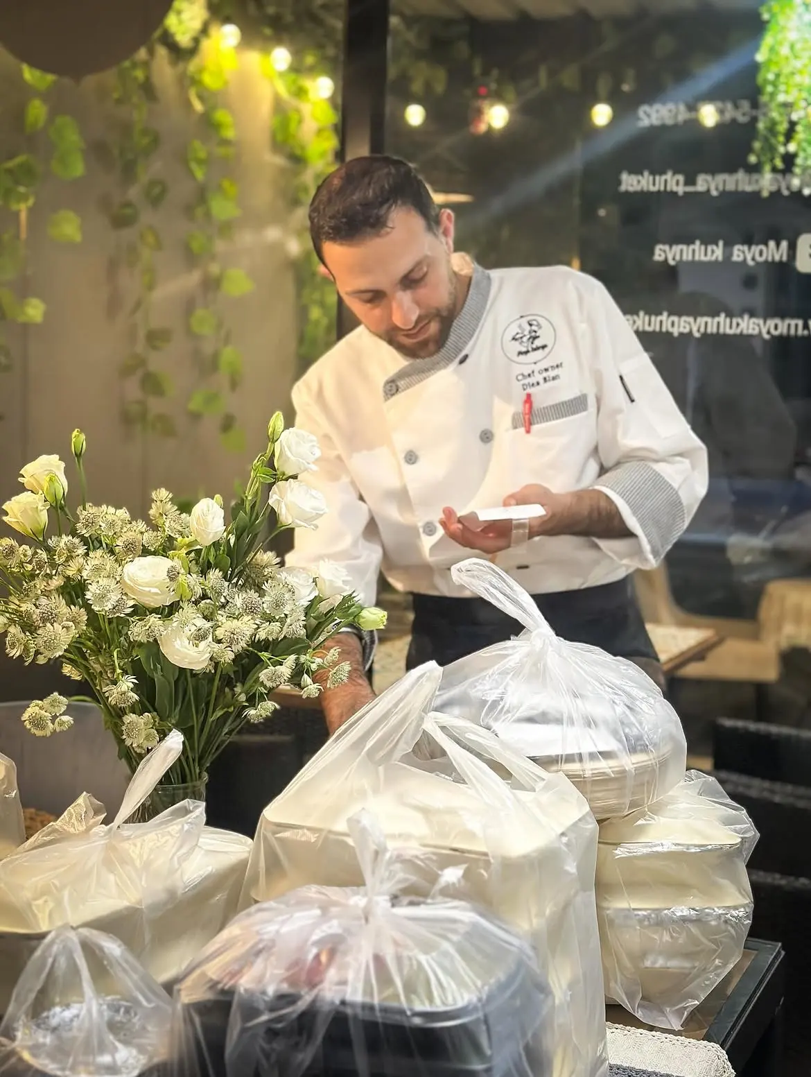 Chef-owner Diea Blan checking an order by the window
